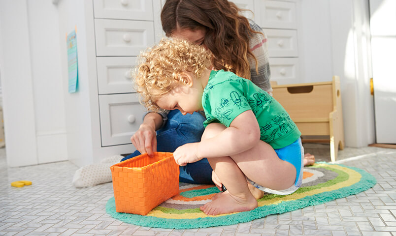 Boy looking in small bin