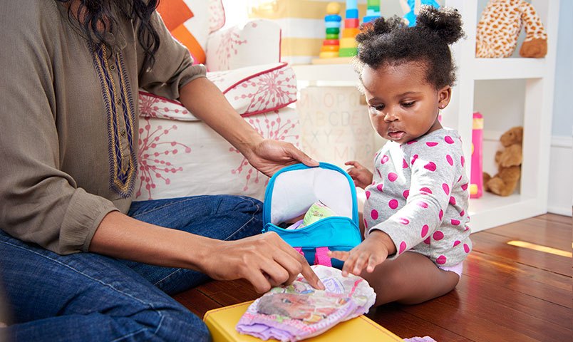 Mother and daughter packing training pants